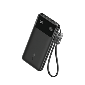 Black power bank with digital display and lanyard on a white background