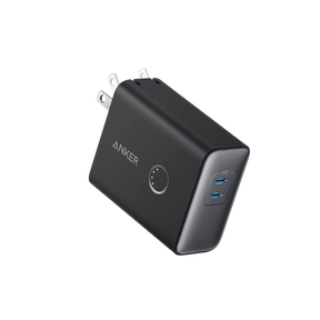 Black Anker power adapter with two USB ports on a white background