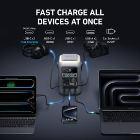 Power station with multiple charging ports connected to laptops, phones, and other devices on a dark background.